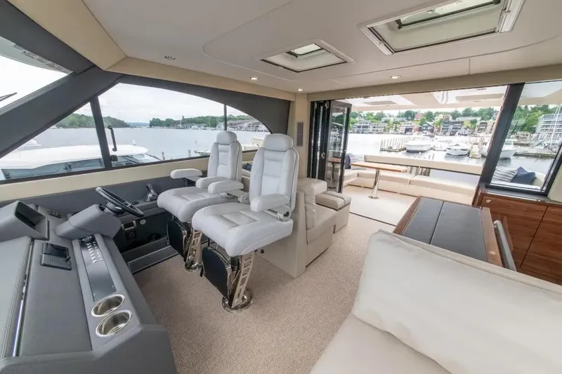 Slide: The Image of Luxurious interior of 2024 Maritimo M55 yacht with panoramic windows and plush seating. - 68