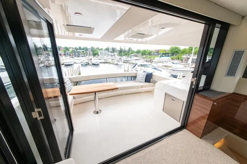 Slide: The Image of Luxurious 2024 Maritimo M55 yacht interior with marina view, featuring sleek design and comfortable seating. - 70