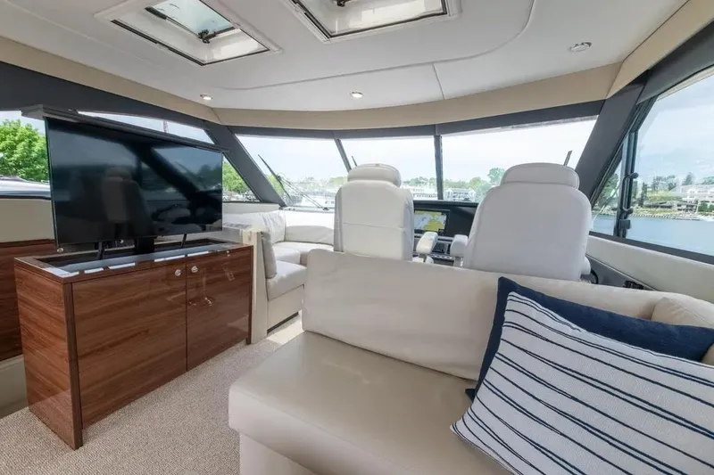 Slide: The Image of Luxurious interior of 2024 Maritimo M55 yacht with modern furnishings and panoramic windows. - 79