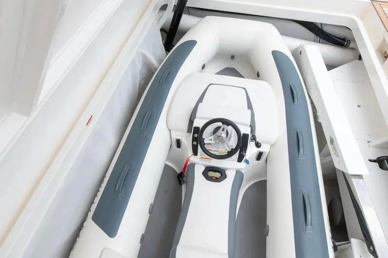 Slide: The Image of 2024 Maritimo M55 yacht with inflatable tender in storage compartment. - 85