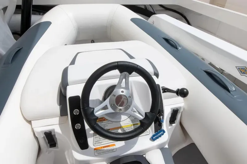 Slide: The Image of 2024 Maritimo M55 boat steering wheel and control panel, featuring sleek design elements. - 88