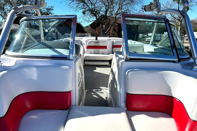 Slide: The Image of 2007 Nautique Super Air Nautique 220 boat interior with red and white seating. - 30