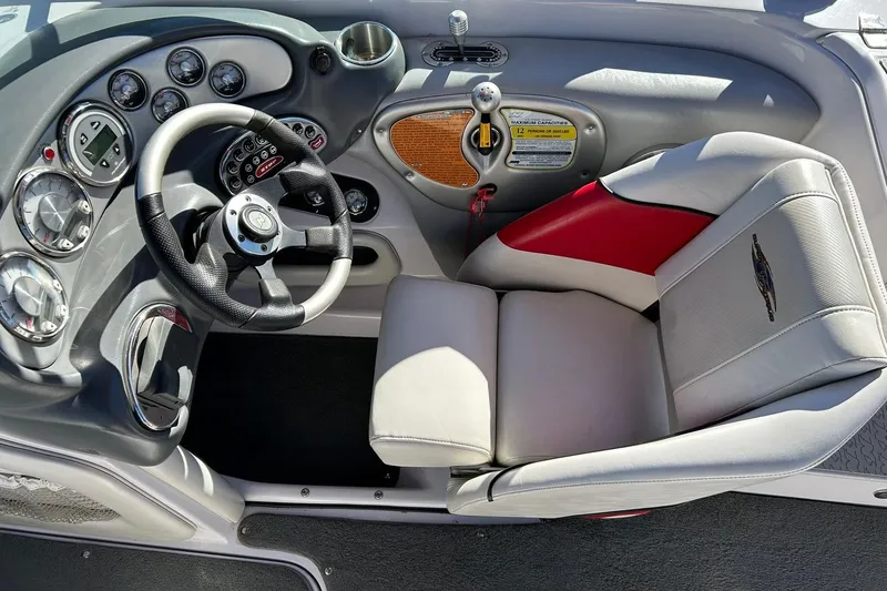 Slide: The Image of 2007 Nautique Super Air Nautique 220 boat cockpit with steering wheel and gauges. - 39