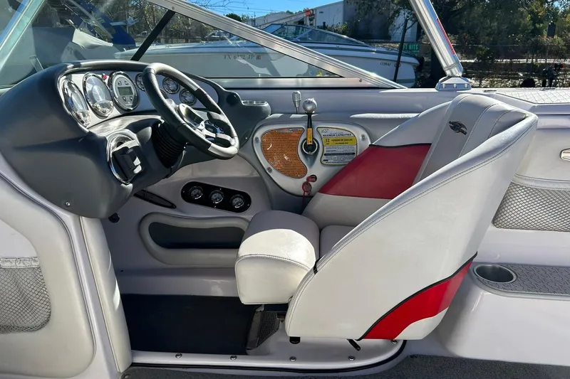 Slide: The Image of 2007 Nautique Super Air Nautique 220 boat interior with steering wheel and dashboard controls. - 40