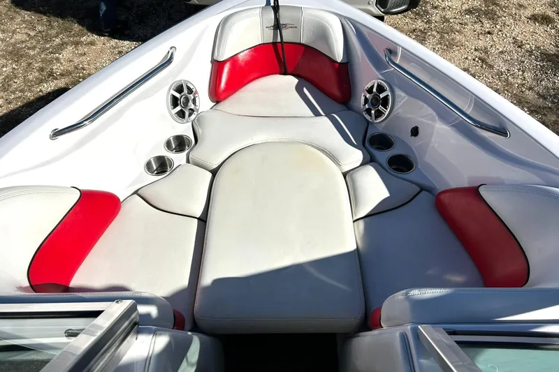 Slide: The Image of 2007 Nautique Super Air Nautique 220 boat interior with red and white seating. - 43