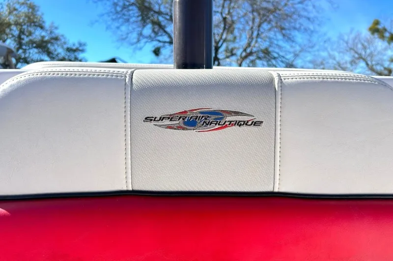 Slide: The Image of 2007 Nautique Super Air Nautique 220 logo on white boat upholstery. - 51