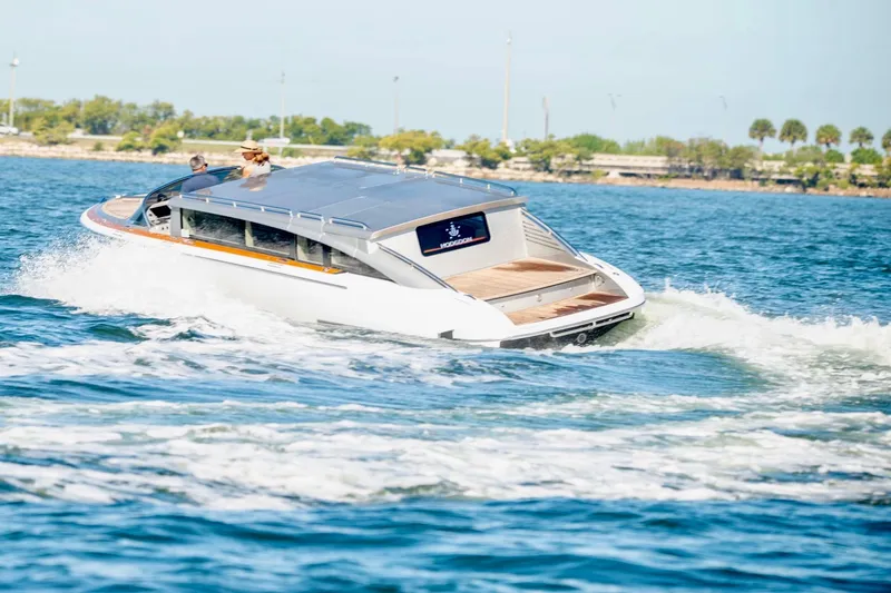 Slide: The Image of 2016 Hodgdon Venetian boat cruising on a sunny day in open water. - 2