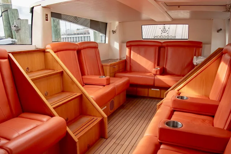 Slide: The Image of Luxurious 2016 Hodgdon Venetian yacht interior with orange leather seating and wooden accents. - 8