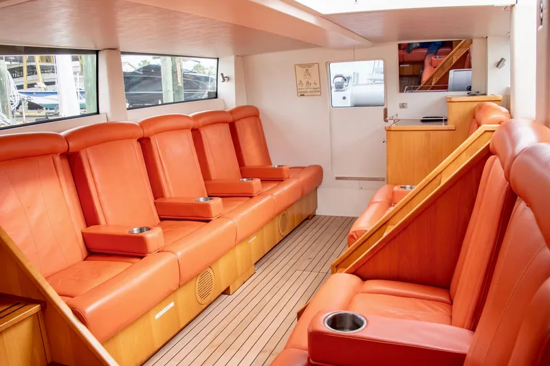 Slide: The Image of Luxurious interior of 2016 Hodgdon Venetian boat with orange leather seating and wood accents. - 9