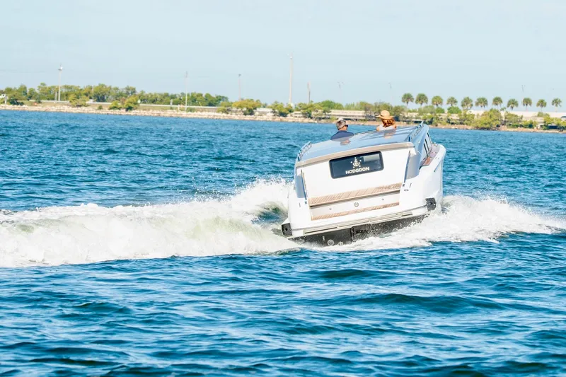 Slide: The Image of 2016 Hodgdon Venetian boat cruising on open water with passengers. - 3