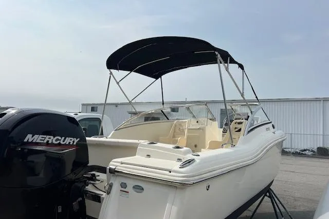 The Image of 2018 Scout Dorado 210 boat with Mercury engine, parked outdoors. - 0