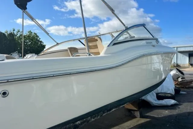 Slide: The Image of 2018 Scout Dorado 210 boat docked under blue sky. - 5