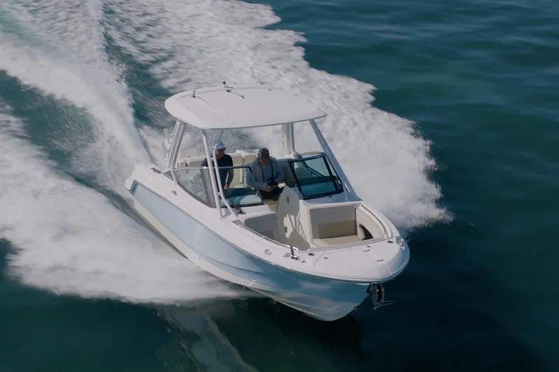 Slide: The Image of 2022 Boston Whaler 240 Vantage cruising on open water, showcasing sleek design and performance. - 3