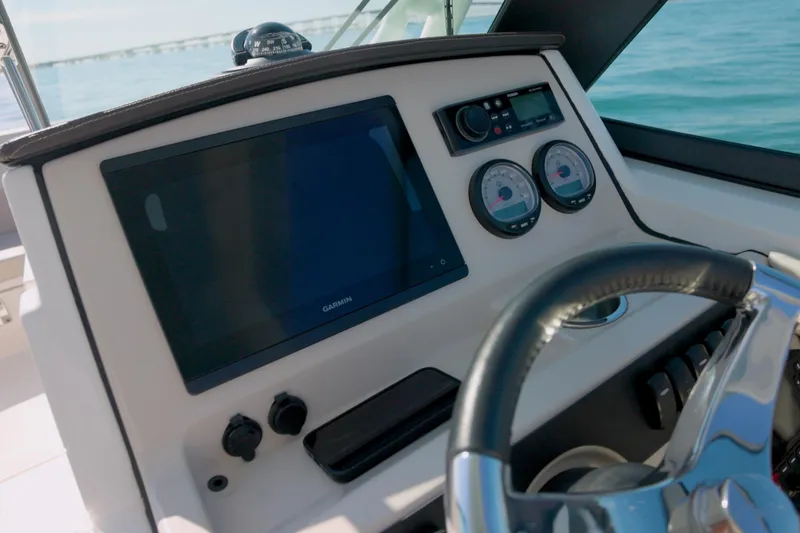 Slide: The Image of Dashboard of 2022 Boston Whaler 240 Vantage with Garmin display and gauges. - 8