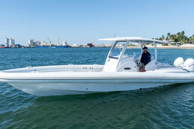 Slide: The Image of 2025 Airship 340 boat on water with cityscape background. - 16