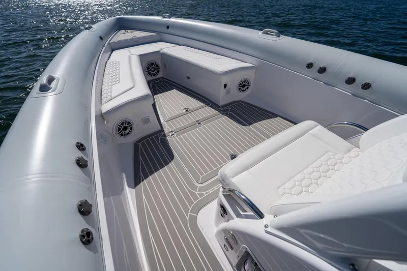 Slide: The Image of Luxurious Airship 340 boat interior with white seating, 2025 model, on calm water. - 18