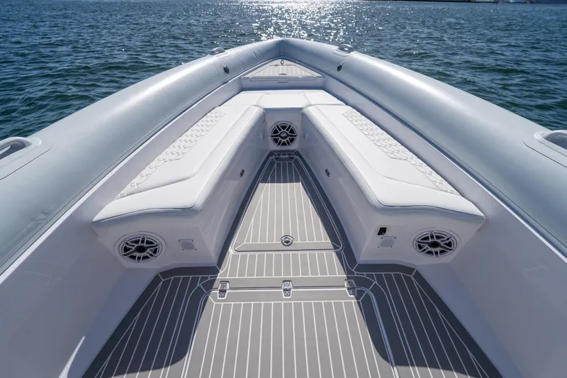 Slide: The Image of Luxurious Airship 340 boat interior, 2025 model, featuring sleek white seating and modern design. - 19