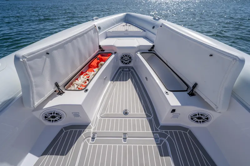 Slide: The Image of Airship 340 boat interior, 2025 model, featuring open storage compartments and sleek design on the water. - 20