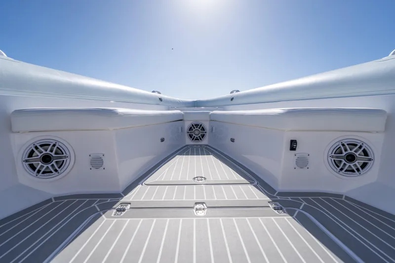 Slide: The Image of Interior view of 2025 Airship 340 boat, featuring sleek seating and integrated speakers. - 21