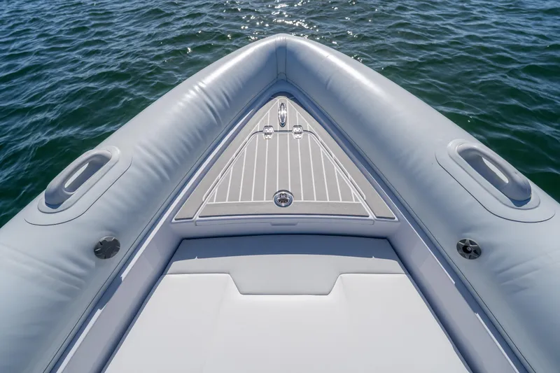 Slide: The Image of Bow view of 2025 Airship 340 inflatable boat on water. - 22