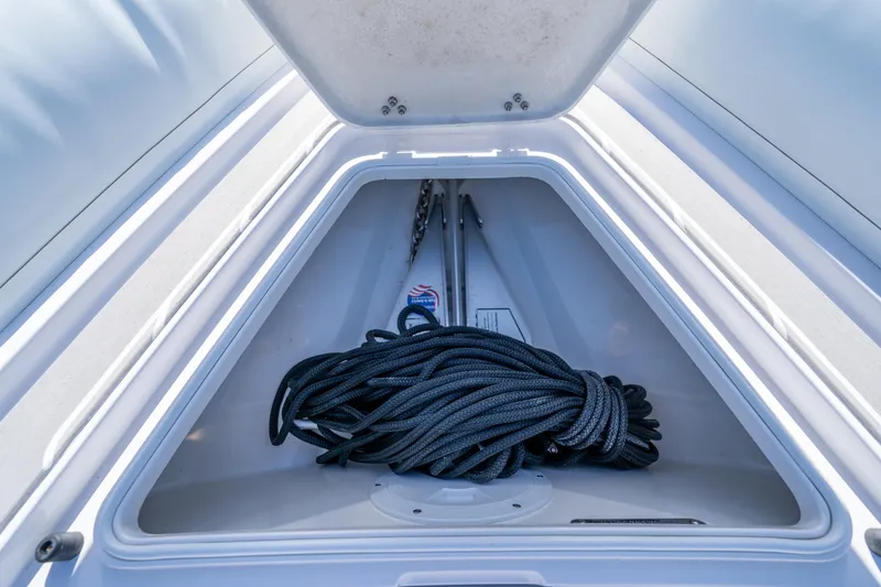 Slide: The Image of Storage compartment of 2025 Airship 340 boat with coiled rope inside. - 23