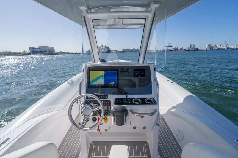 Slide: The Image of Cockpit view of 2025 Airship 340 boat with modern navigation system on open water. - 30