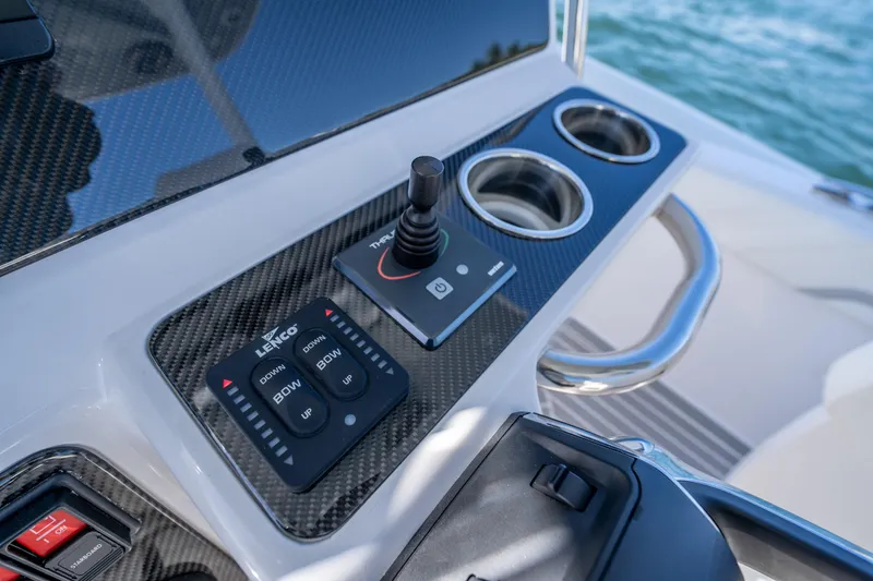Slide: The Image of Control panel of 2025 Airship 340 boat with joystick and cup holders. - 33