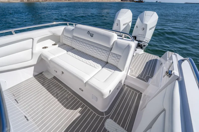 Slide: The Image of Luxurious Airship 340 boat interior with white seating, 2025 model, on a sunny day at sea. - 37