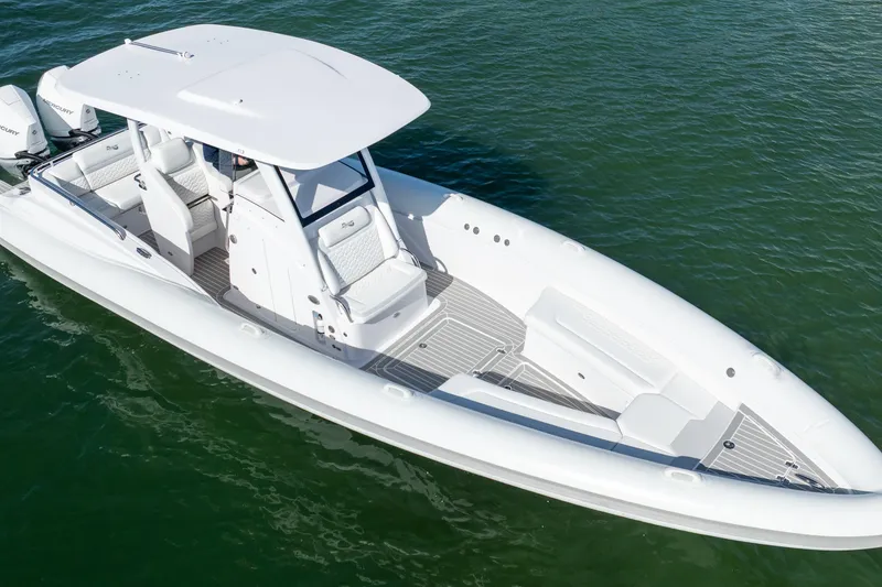 Slide: The Image of 2025 Airship 340 boat on water, sleek white design, spacious seating. - 7