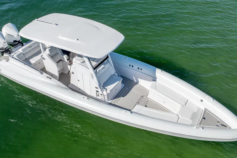 Slide: The Image of Modern Airship 340 boat, 2025 model, cruising on clear green water. - 9