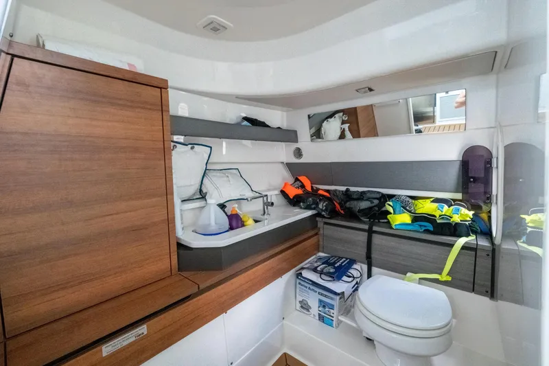 Slide: The Image of Interior of 2021 Tiara Sport 38 LX boat with life jackets and marine supplies. - 23
