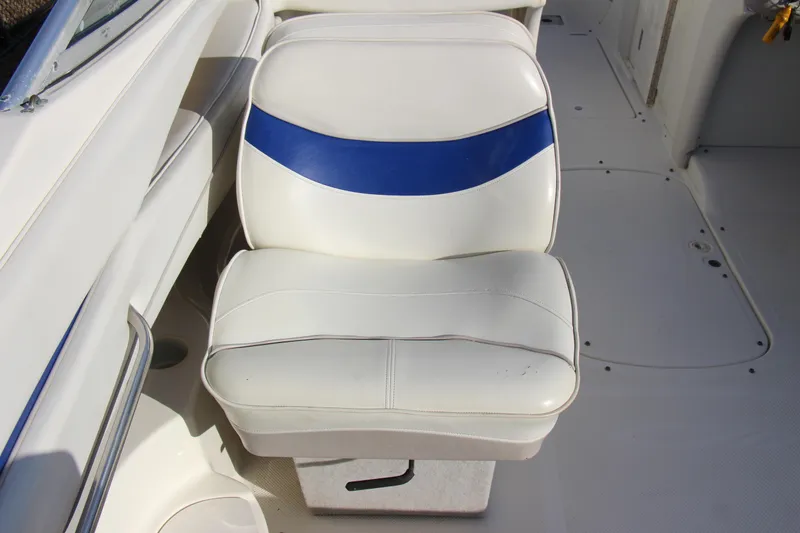 Slide: The Image of White and blue seat on 2004 Maxum 2400 SR boat interior. - 11