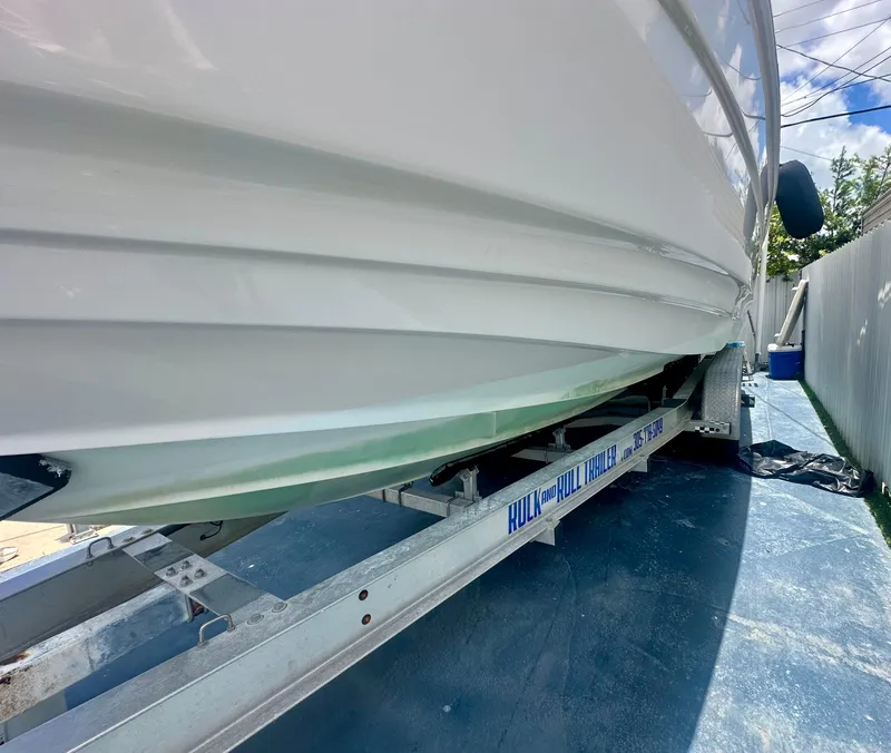 Slide: The Image of 2001 Regal Commodore 2760 boat on trailer, side view, sunny day. - 11