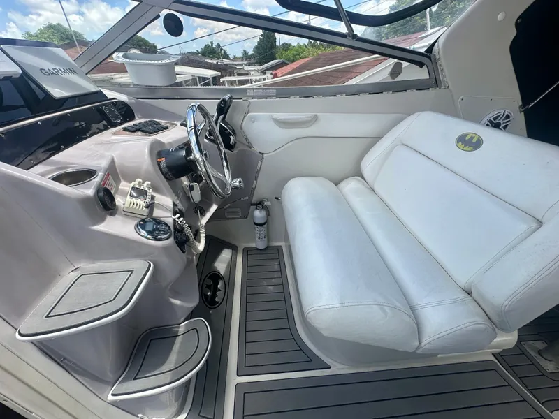 Slide: The Image of 2001 Regal Commodore 2760 boat cockpit with white seating and steering wheel. - 22