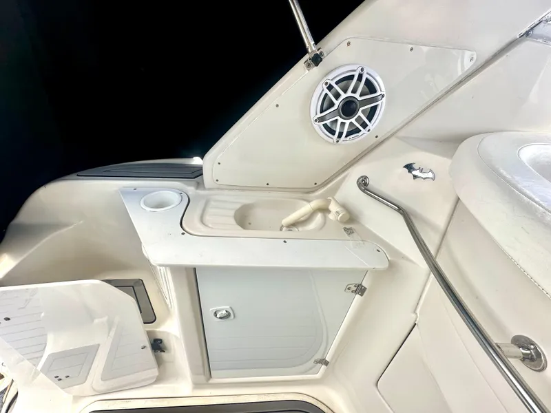 Slide: The Image of 2001 Regal Commodore 2760 boat interior with speaker, sink, and storage compartments. - 27