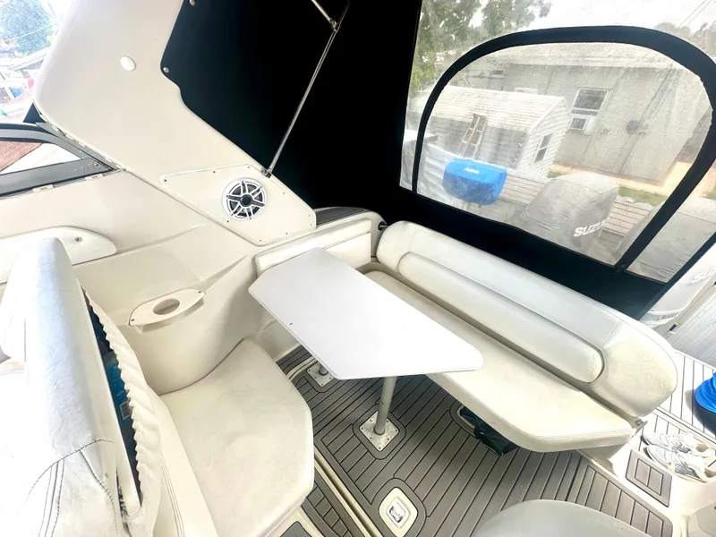 Slide: The Image of 2001 Regal Commodore 2760 boat interior with seating and table, featuring a modern design. - 28