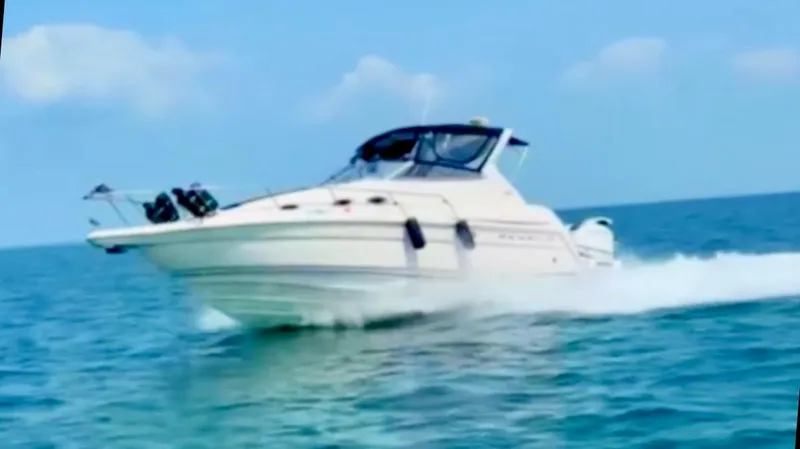 Slide: The Image of 2001 Regal Commodore 2760 cruising on open water under clear skies. - 3