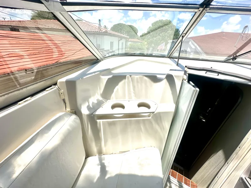 Slide: The Image of 2001 Regal Commodore 2760 boat interior with seating and cup holders. - 33