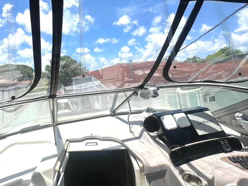 Slide: The Image of Interior view of 2001 Regal Commodore 2760 boat cockpit with clear skies. - 36