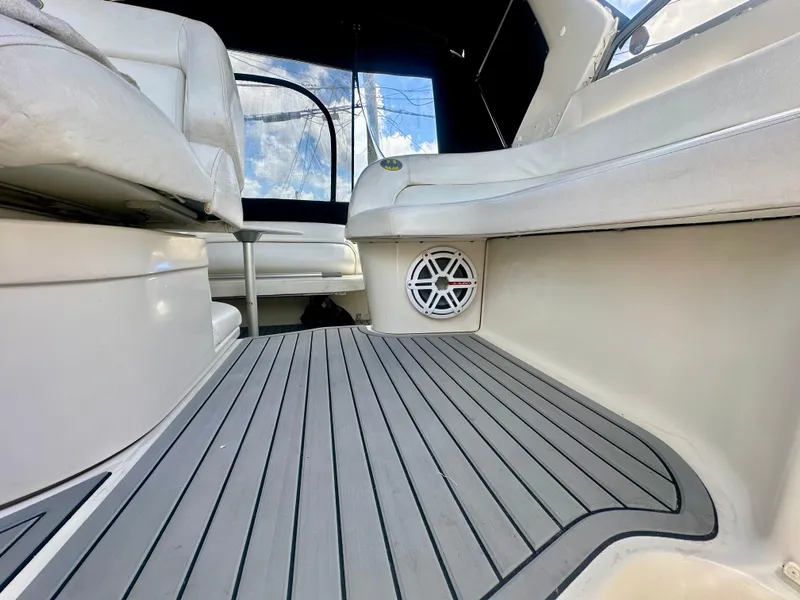 Slide: The Image of 2001 Regal Commodore 2760 boat interior with cushioned seating and marine speaker. - 37