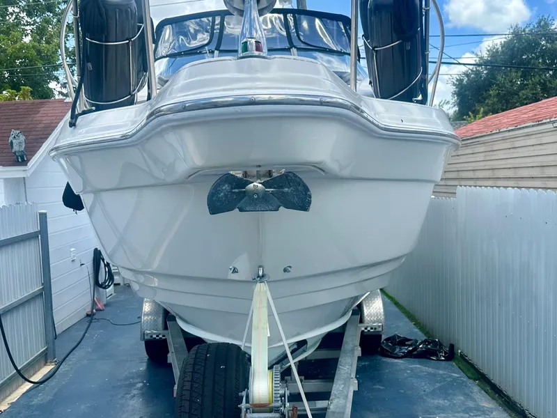 Slide: The Image of 2001 Regal Commodore 2760 boat on trailer in driveway, front view. - 4