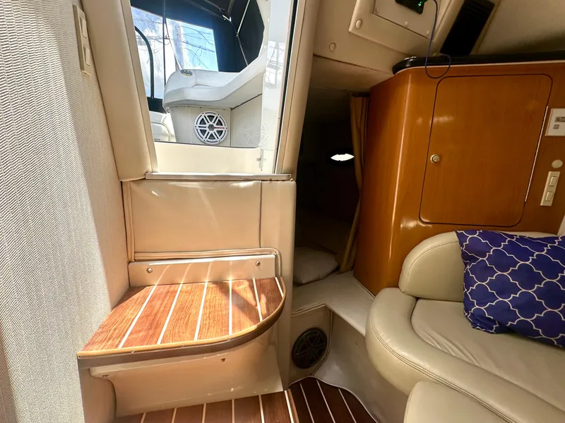 Slide: The Image of Interior of 2001 Regal Commodore 2760 boat with seating and wooden accents. - 47