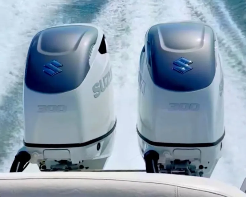Slide: The Image of Twin Suzuki 300 outboard engines powering a 2001 Regal Commodore 2760 boat. - 77