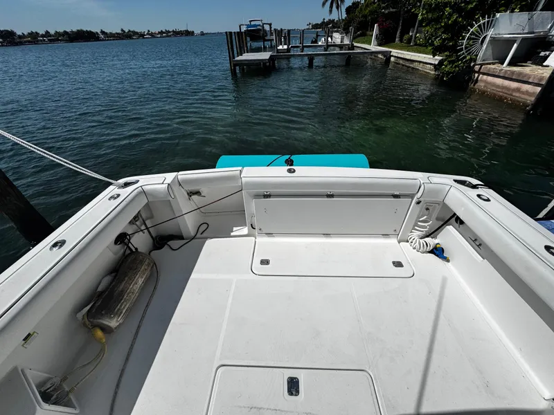 Slide: The Image of 2000 Tiara Yachts 3500 Open boat deck overlooking serene waterfront. - 12