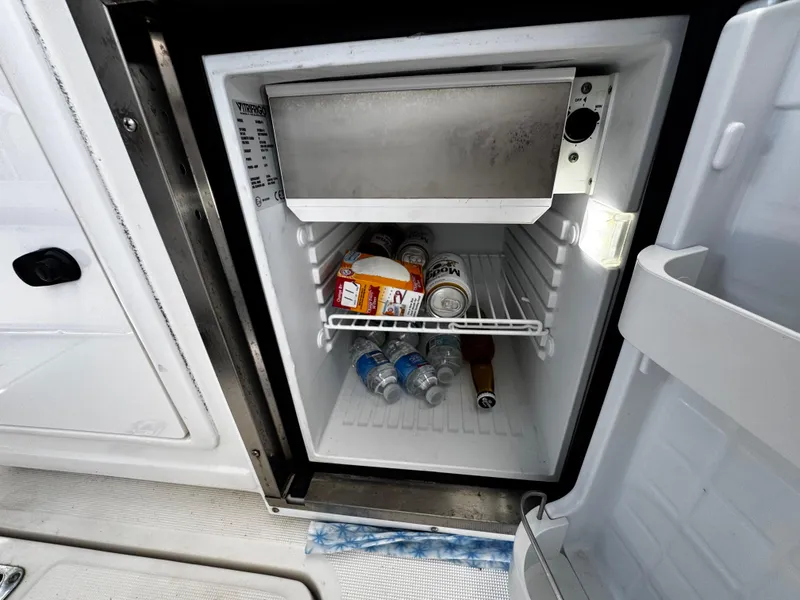 Slide: The Image of Mini fridge on 2000 Tiara Yachts 3500 Open, stocked with drinks and snacks. - 15