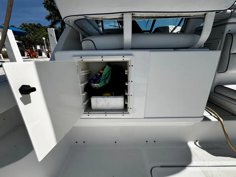 Slide: The Image of Open storage compartment on 2000 Tiara Yachts 3500 Open boat deck. - 16