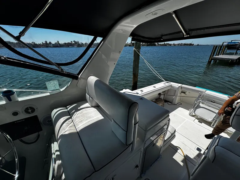 Slide: The Image of 2000 Tiara Yachts 3500 Open interior with seating, overlooking serene waterfront. - 20