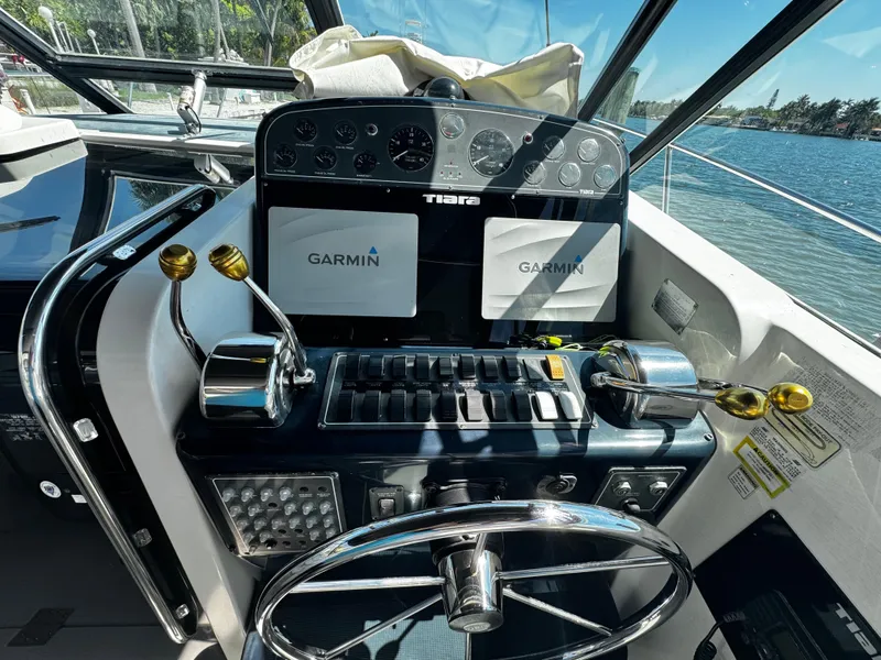 Slide: The Image of Helm of 2000 Tiara Yachts 3500 Open with Garmin navigation systems. - 23