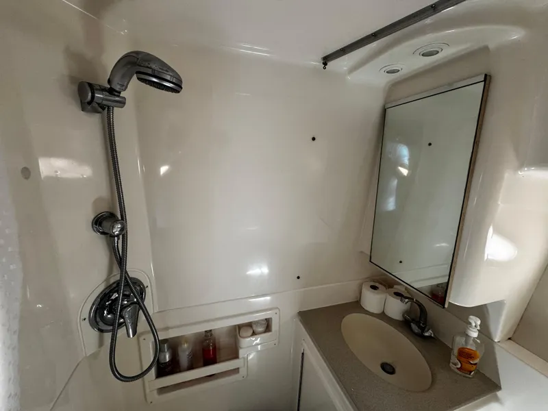 Slide: The Image of Bathroom interior of 2000 Tiara Yachts 3500 Open with shower and sink. - 35