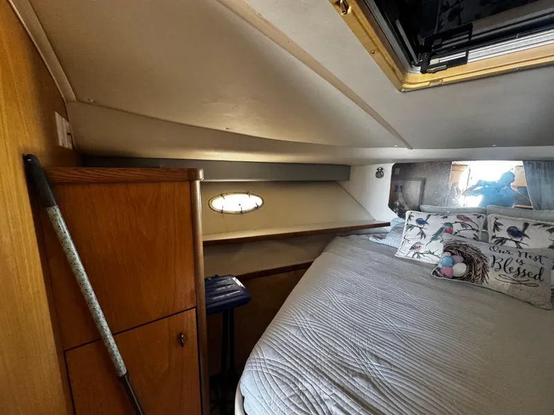 Slide: The Image of Cozy cabin interior of 2000 Tiara Yachts 3500 Open with bed and wooden cabinetry. - 38